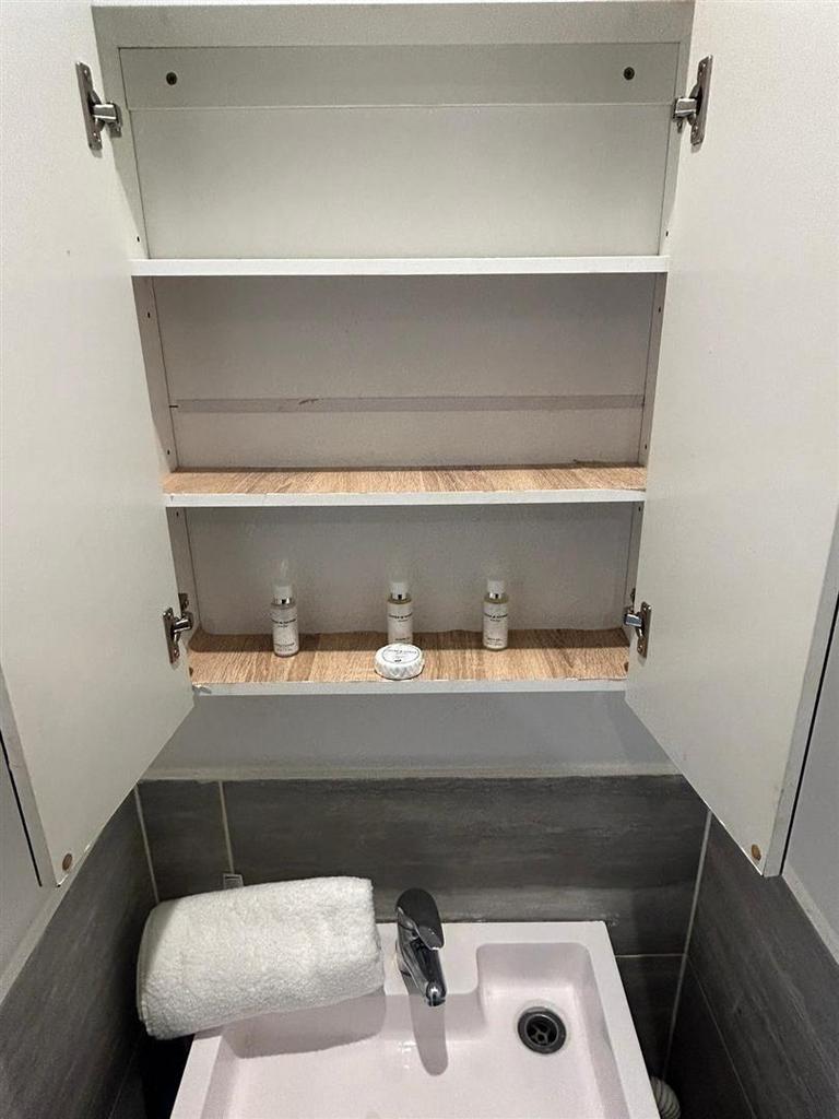 Room bathroom cupboard.jpg