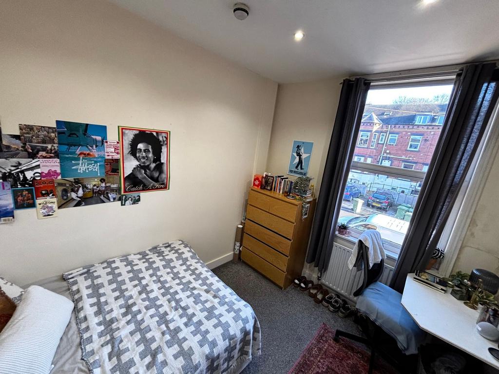 Bright, cosy bedroom with a double bed, decorat...