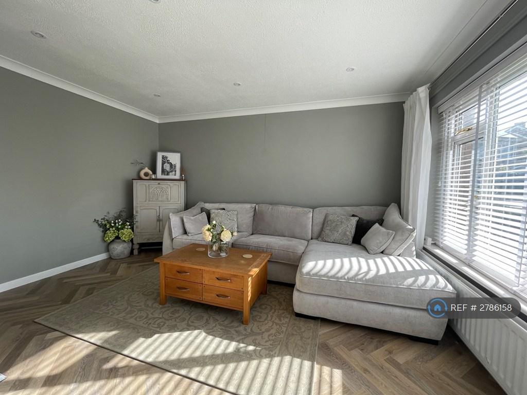 Lounge Area With Newly Fitted Flooring And Blinds