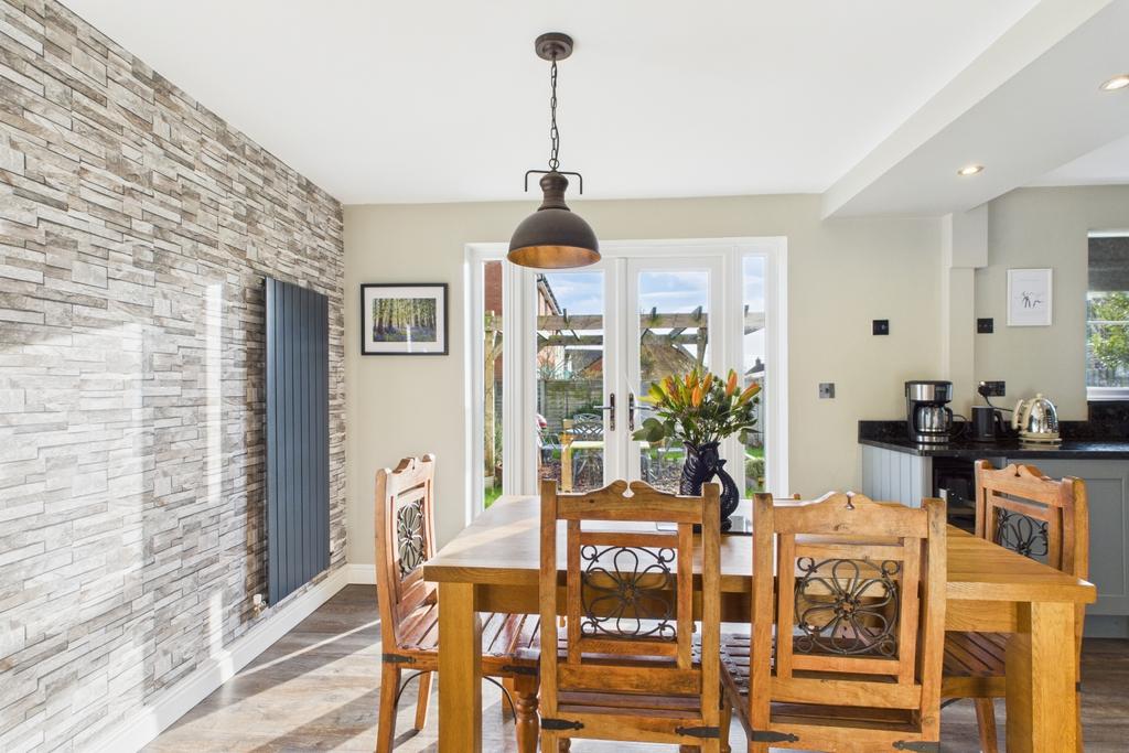 Enjoy meals with the patio doors open to the garde