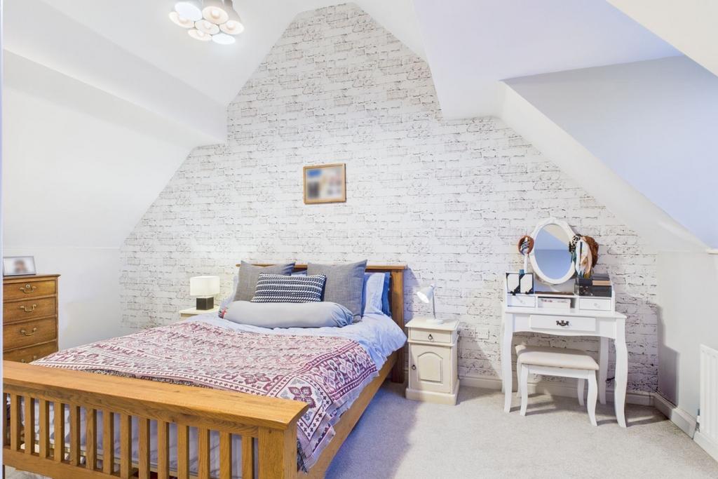 Principle bedroom with pitched ceiling