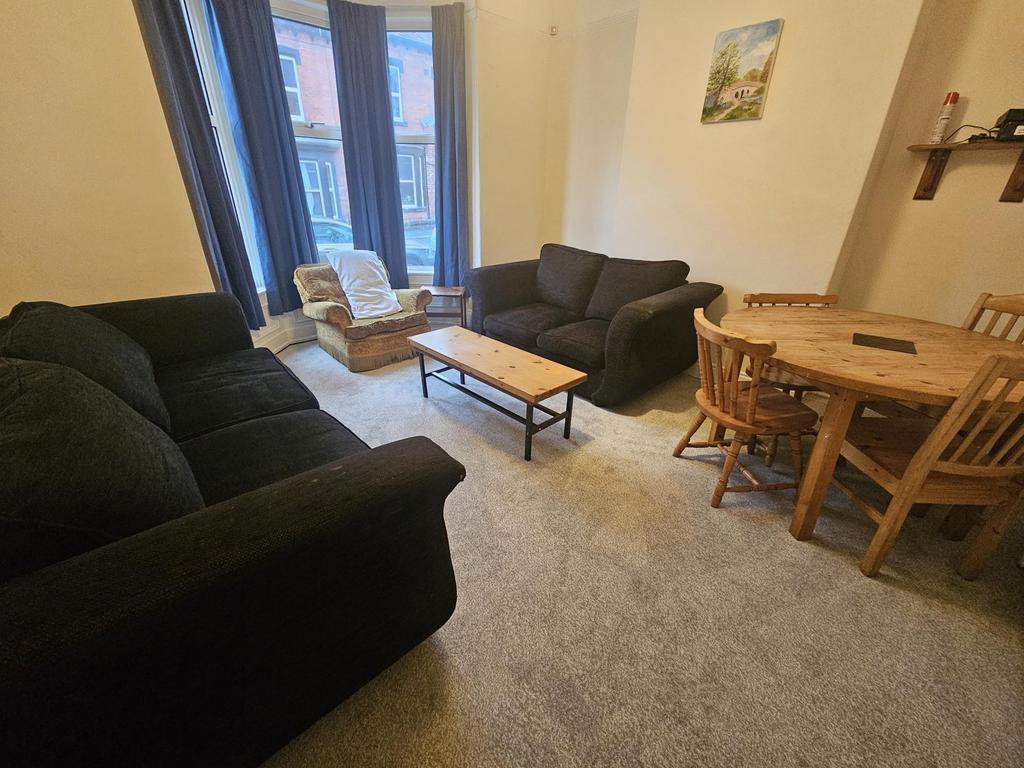 Bright, comfortable living room with two matchi...