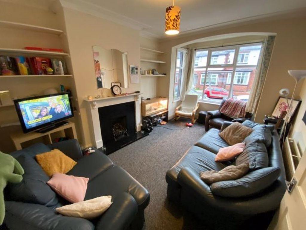 Bright, well-furnished living room with comfort...