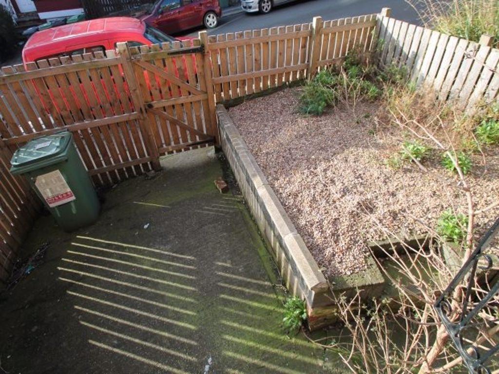 Low-maintenance private rear courtyard with fen...