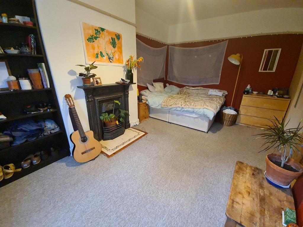 Bright, neatly presented bedroom with a comfort...