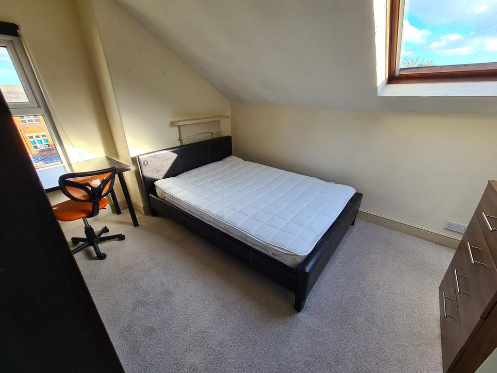 A bright and clean small room featuring a singl...