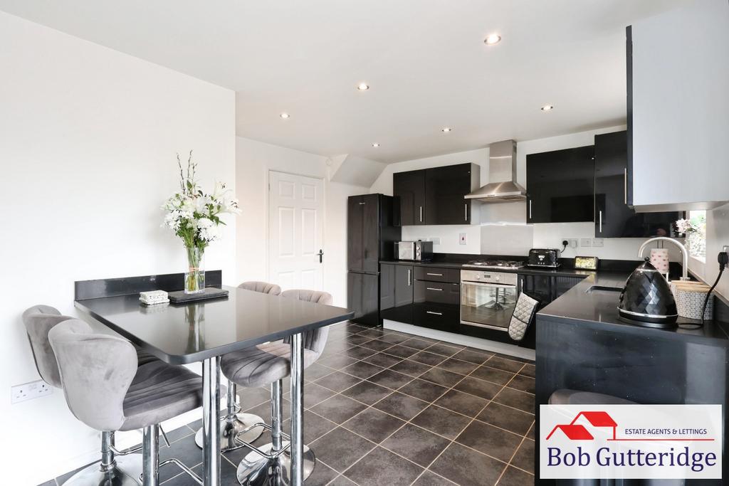 Open plan fitted kitchen / dining room