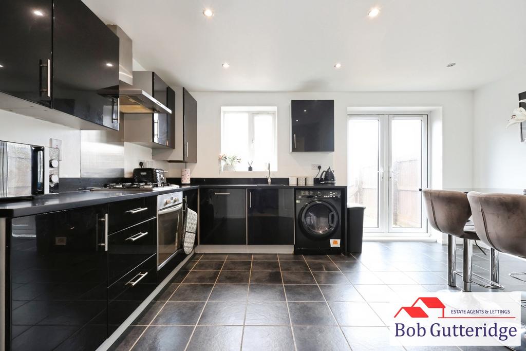 Open plan fitted kitchen / dining room