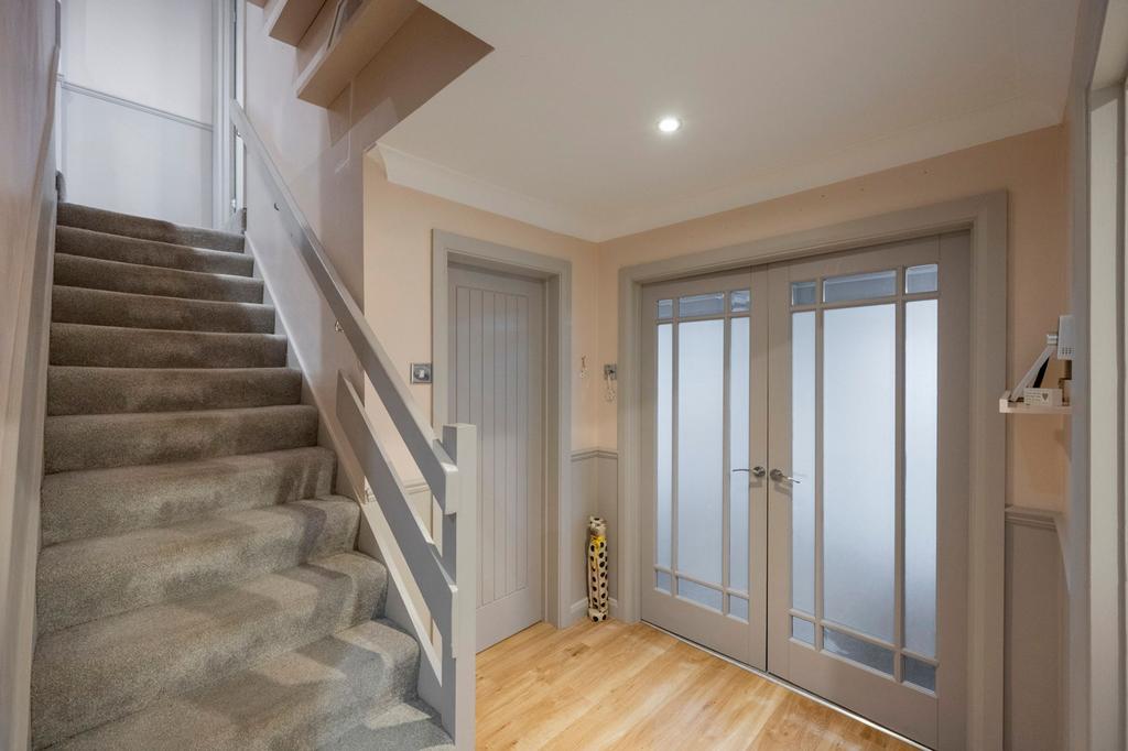 Generous Entrance Hall with Store Room