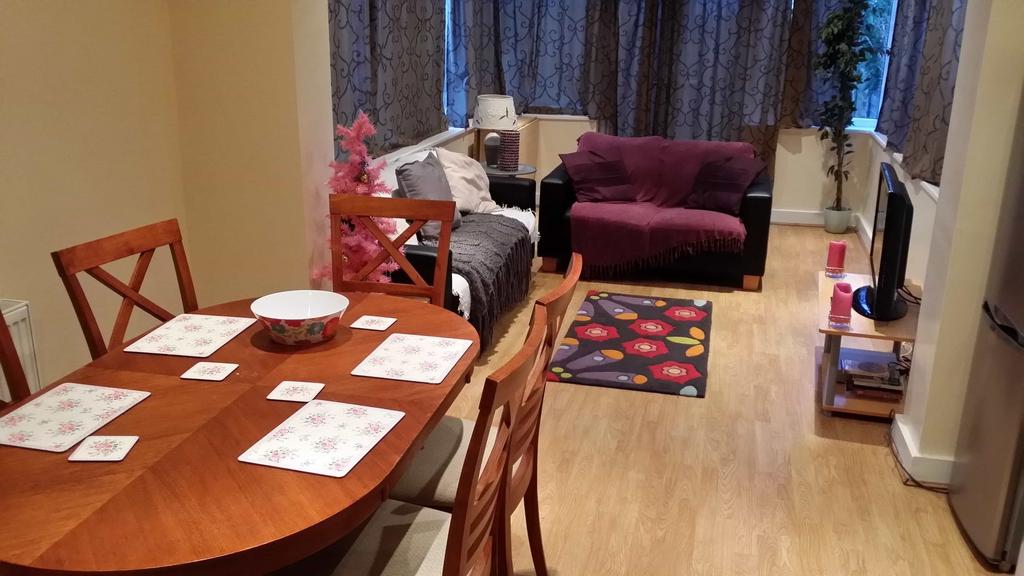 A spacious and inviting living room featuring a...