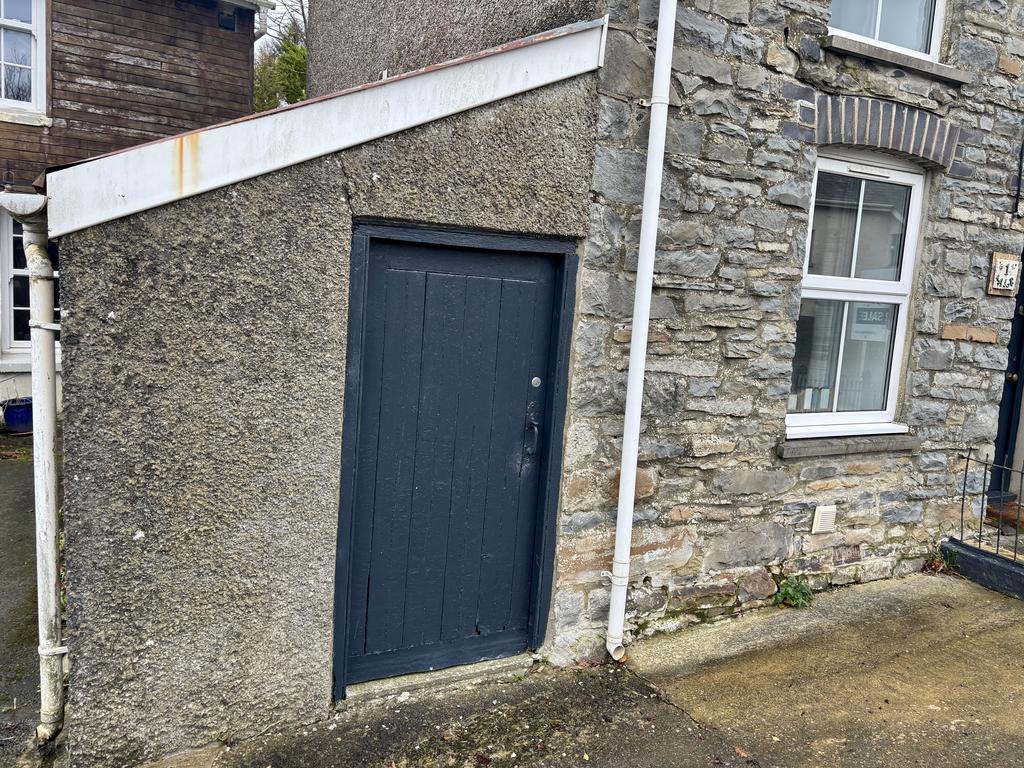 Adjoining stone and slate store shed