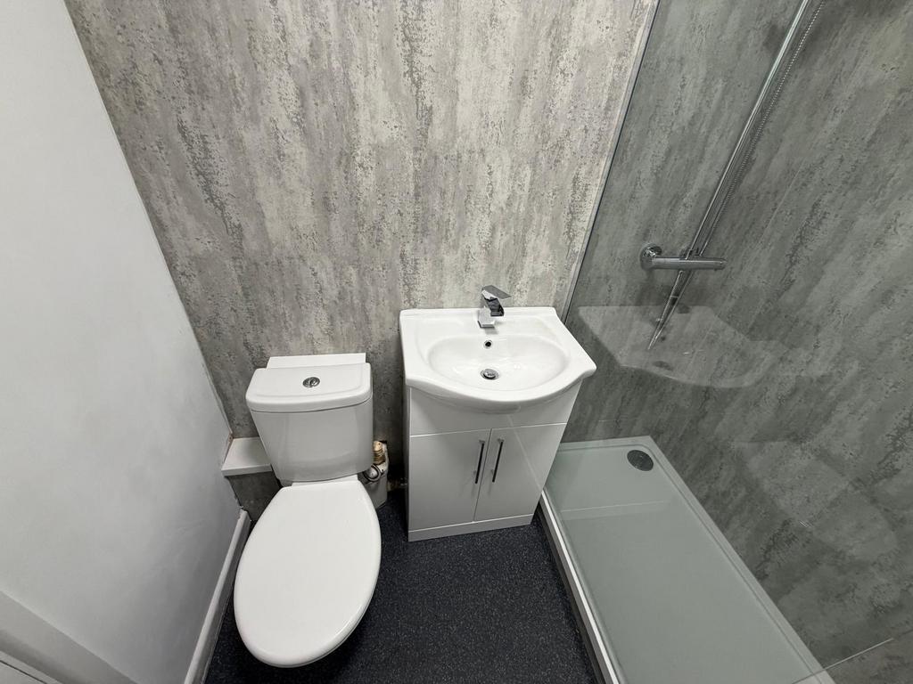 Well-presented bathroom with a modern sink cabi...