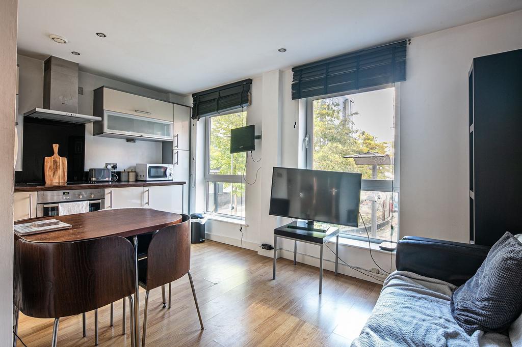 Bright open-plan living area with large windows...