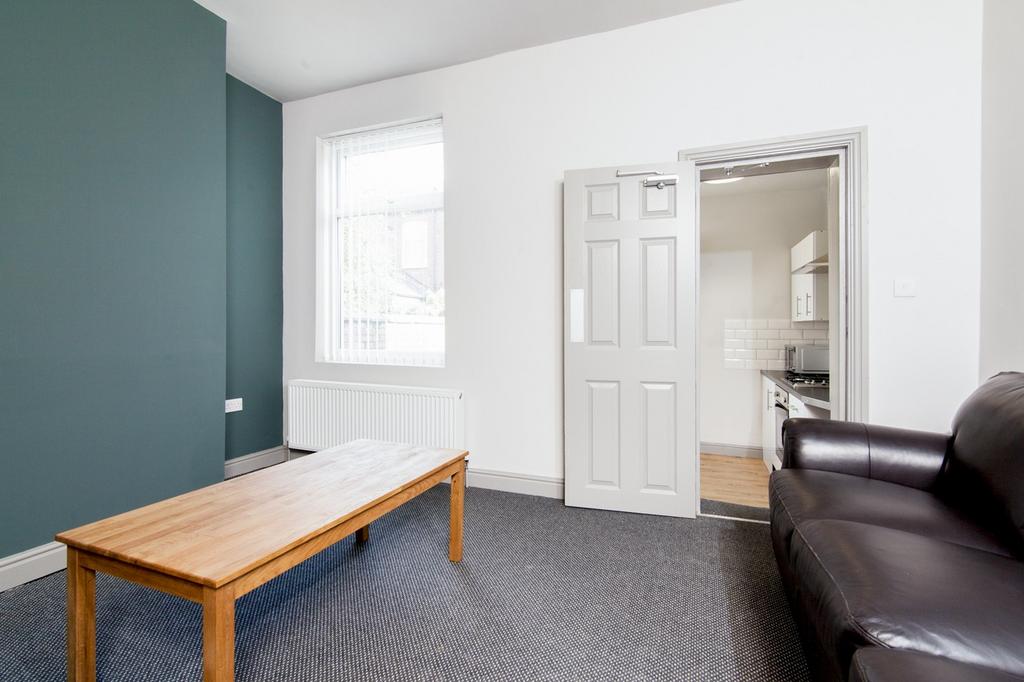 Spacious living room featuring a comfortable so...
