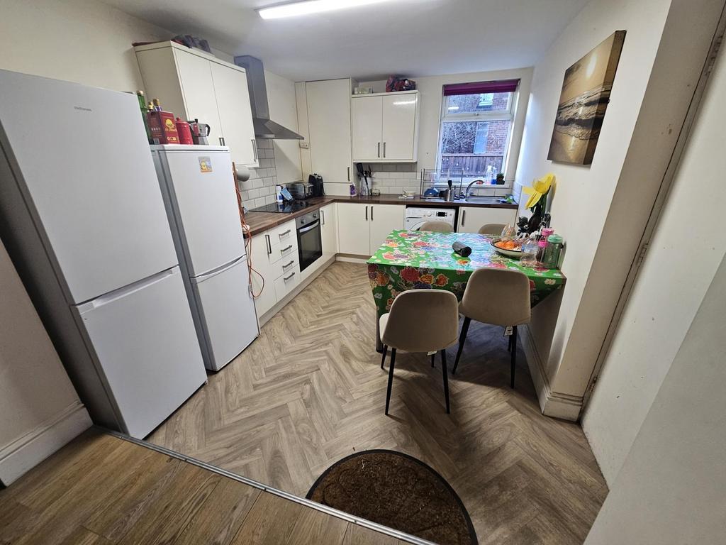 Bright, modern kitchen with fitted units, integ...