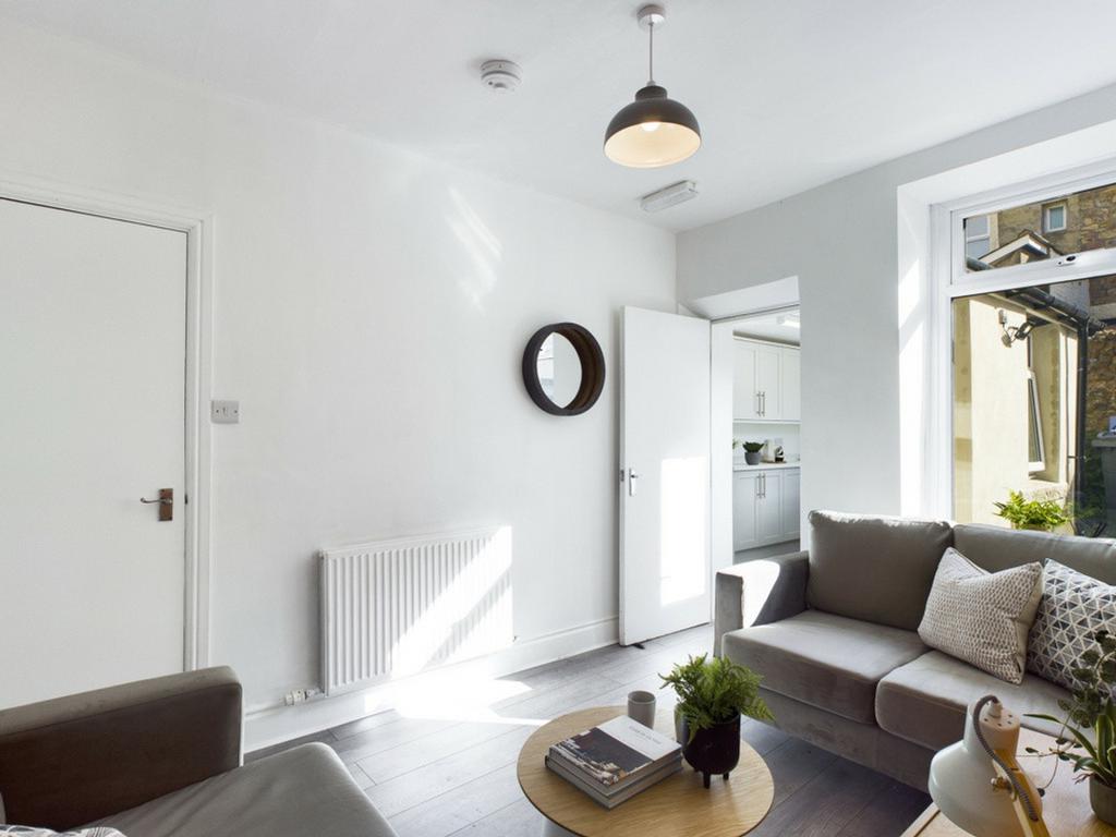 A bright and inviting large modern living room ...