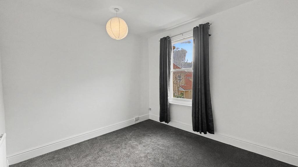 Bright, neutral bedroom with fresh white walls,...