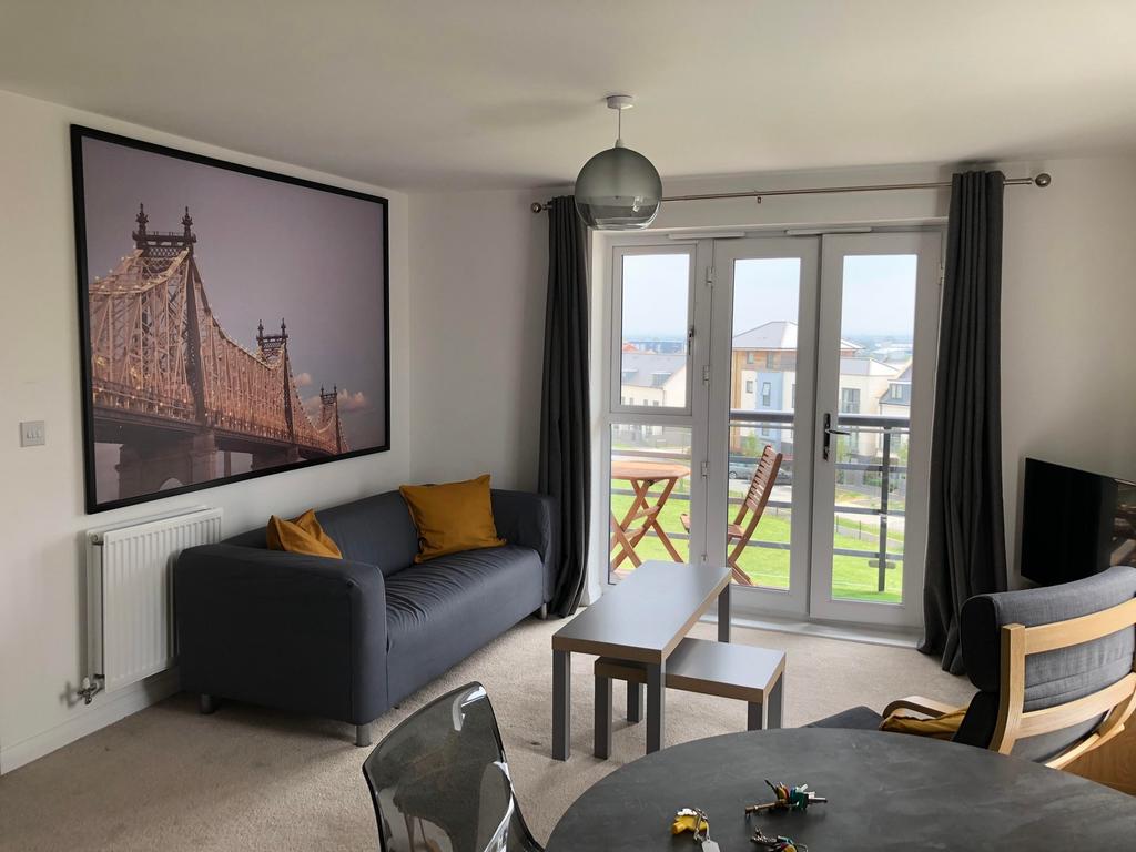 A bright and inviting large modern living room ...
