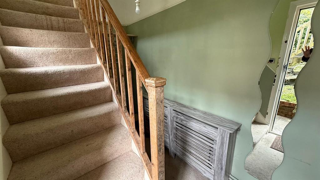 Stairs rising to Second Floor