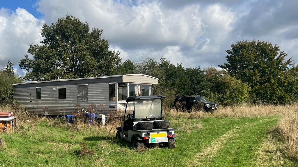 The land includes a mobile home.