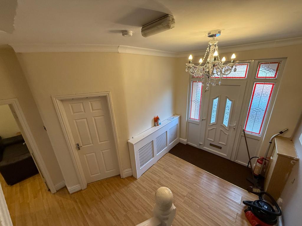 Bright, welcoming entrance hallway with decorat...