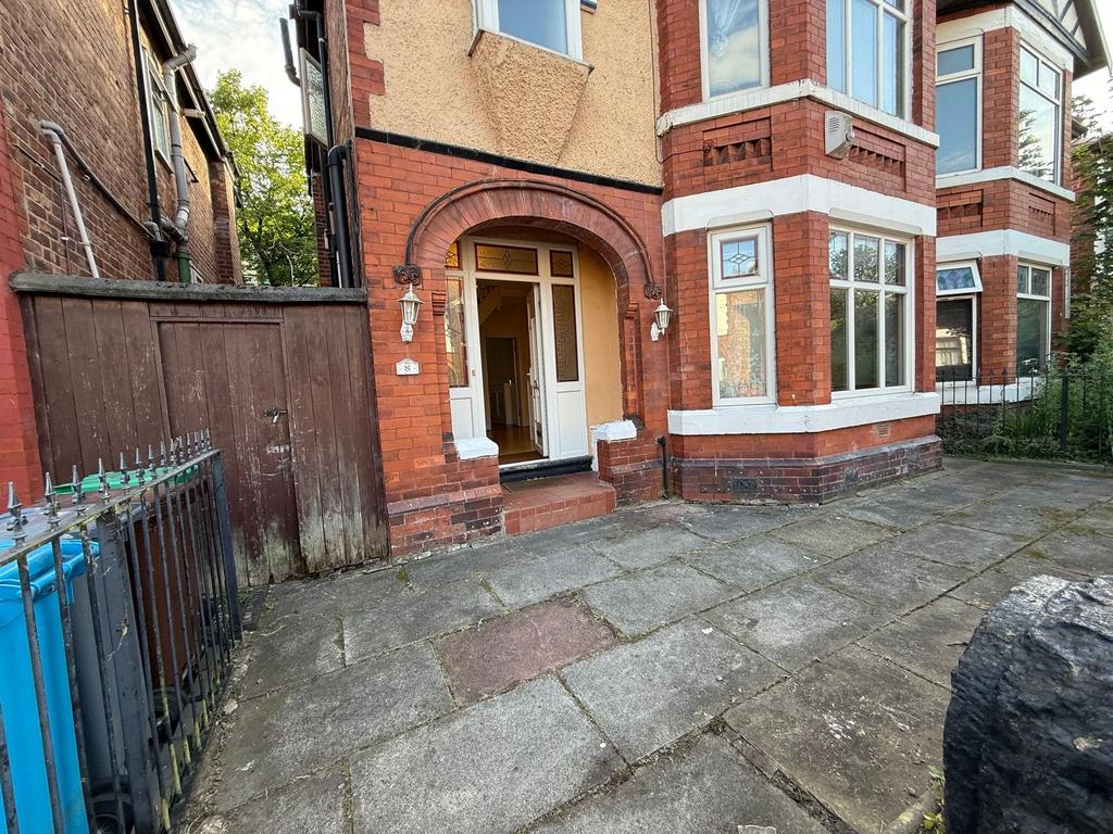 Red-brick period house with a covered entrance ...