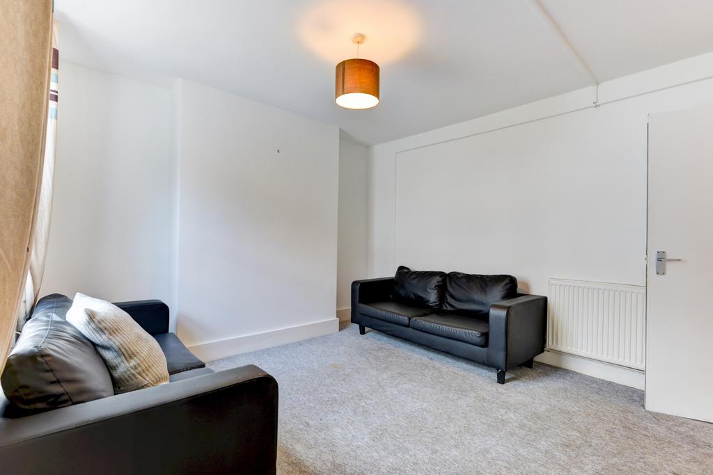 A well-maintained, modern living room featuring...