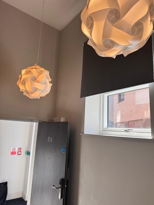 Bright, modern hallway with high ceilings, cont...