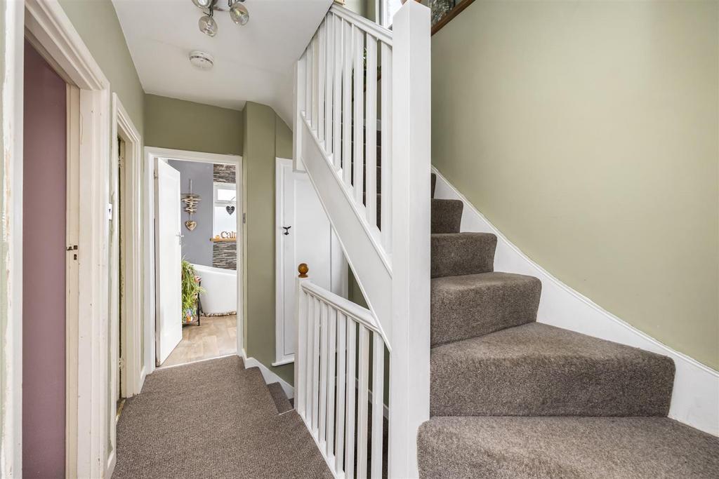 Stairs rising to Second Floor