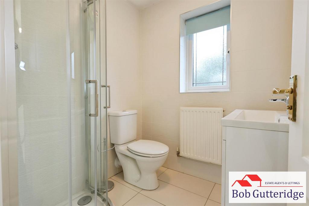 Luxury fully tiled en suite shower room