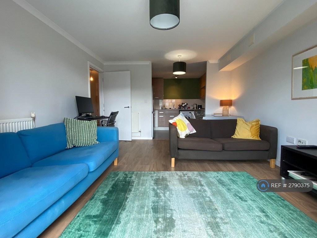 Looking In From Balcony To Living Area And Kitchen