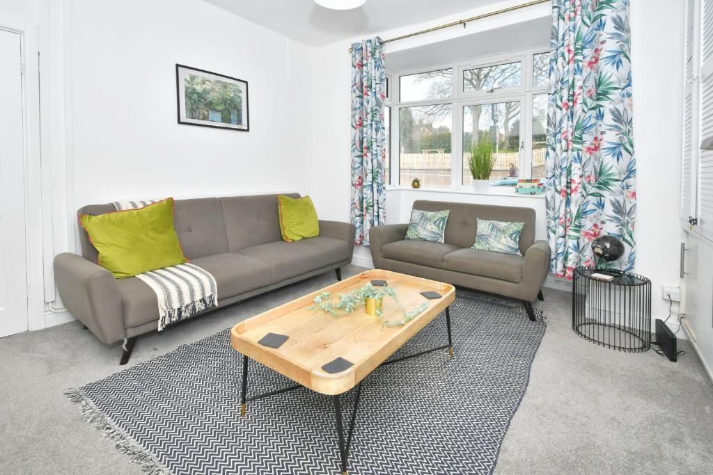 Bright, modern living room with two comfortable...