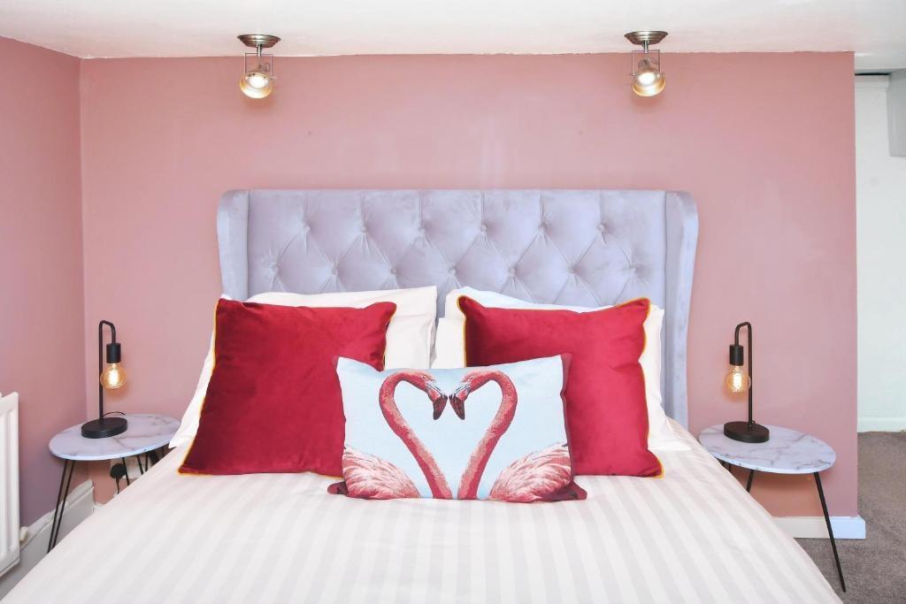 Bright, stylish bedroom with a plush tufted hea...