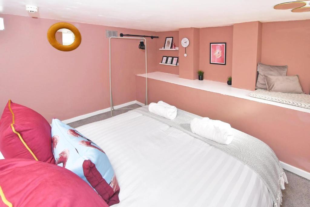 Bright, stylishly decorated bedroom with a comf...