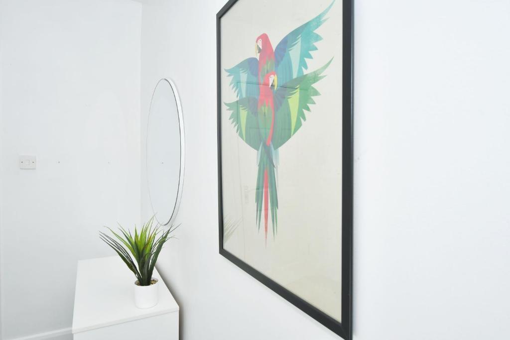 Bright, minimalist hallway with white walls, a ...