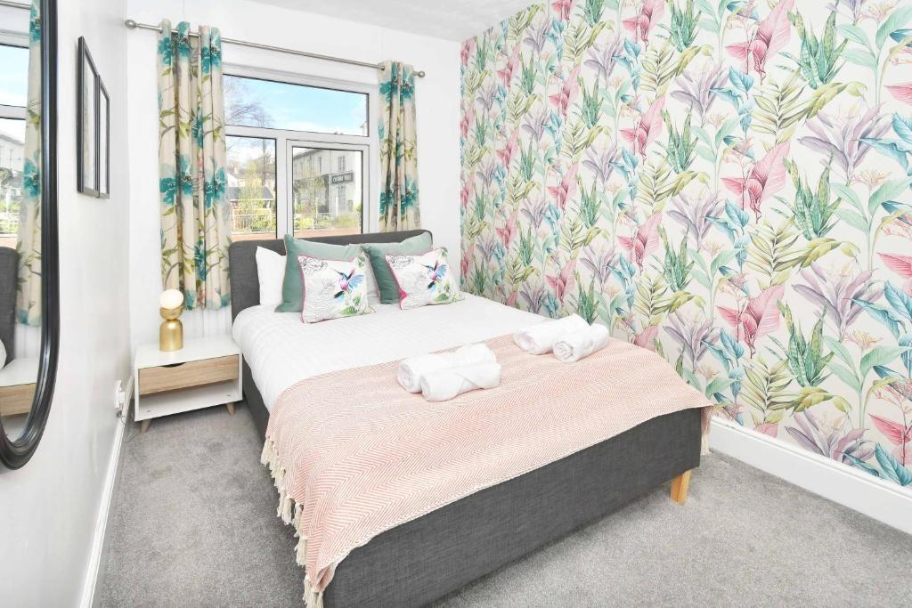 Bright, neatly styled bedroom with a double bed...