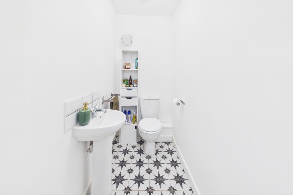 A sleek white WC where pattern adds personality
