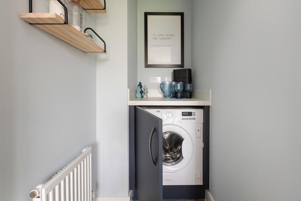 A handy utility space sits off the kitchen/diner