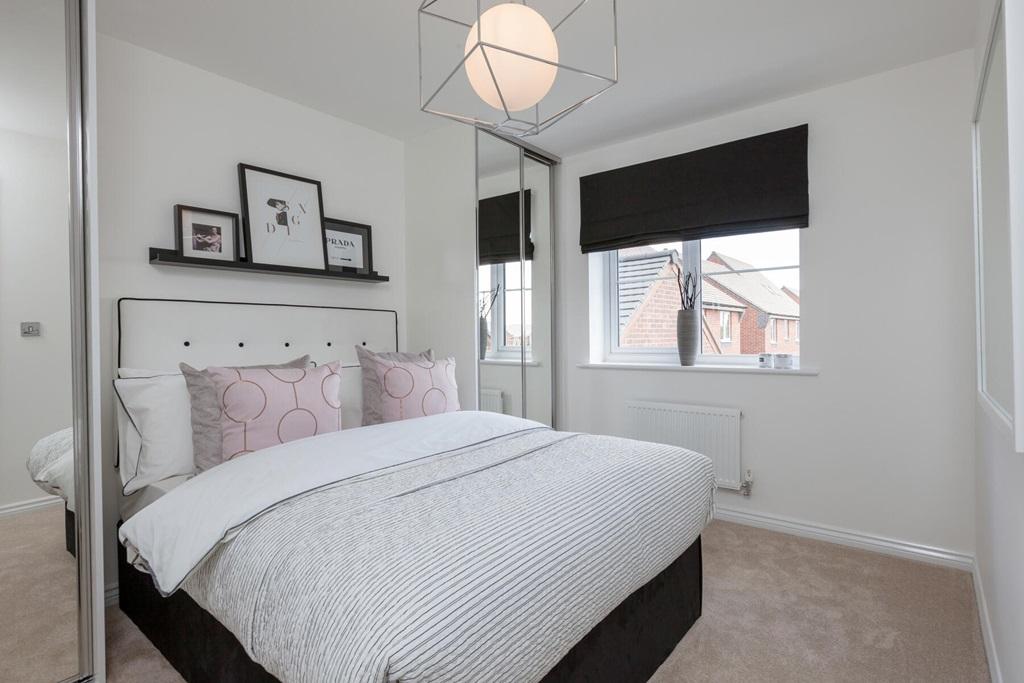 A cosy bedroom that creates an inviting...