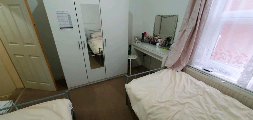 Bright, neatly presented bedroom with two singl...