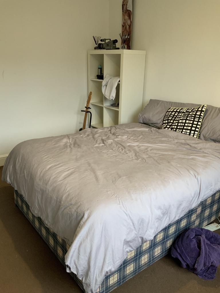 Bright, simply furnished double bedroom with a ...