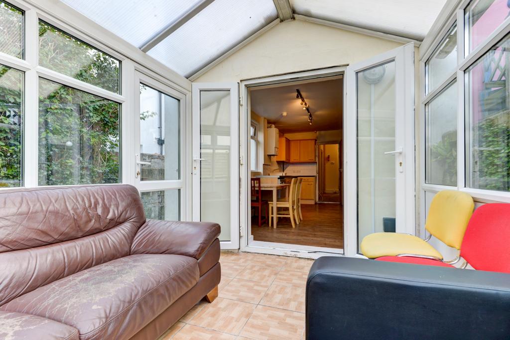A bright and airy living room with large window...