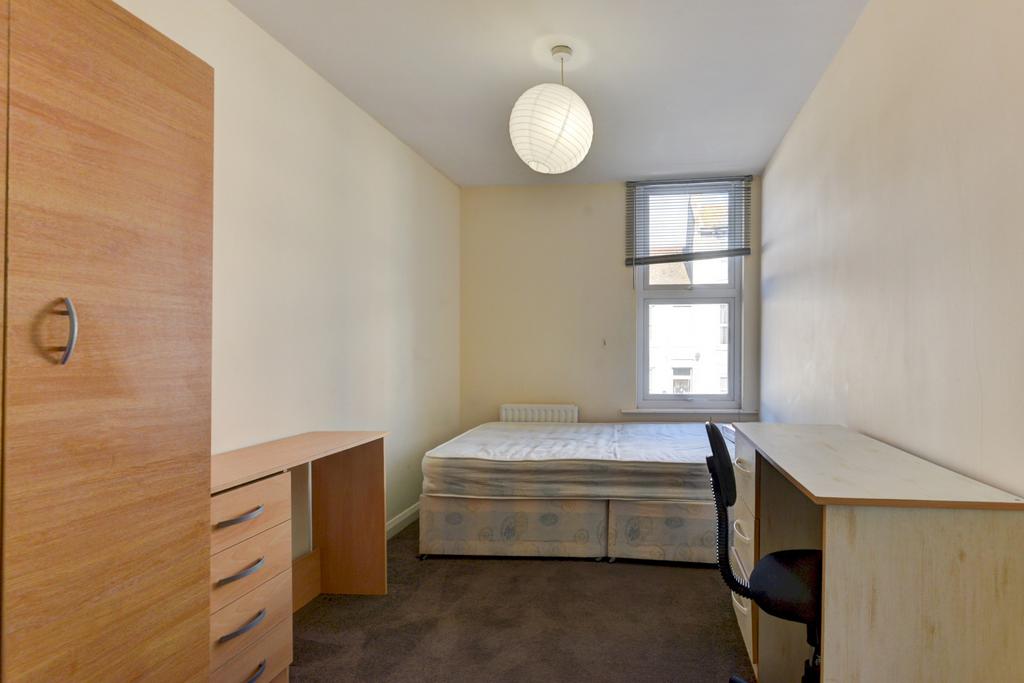 Neat single bedroom featuring a raised single b...