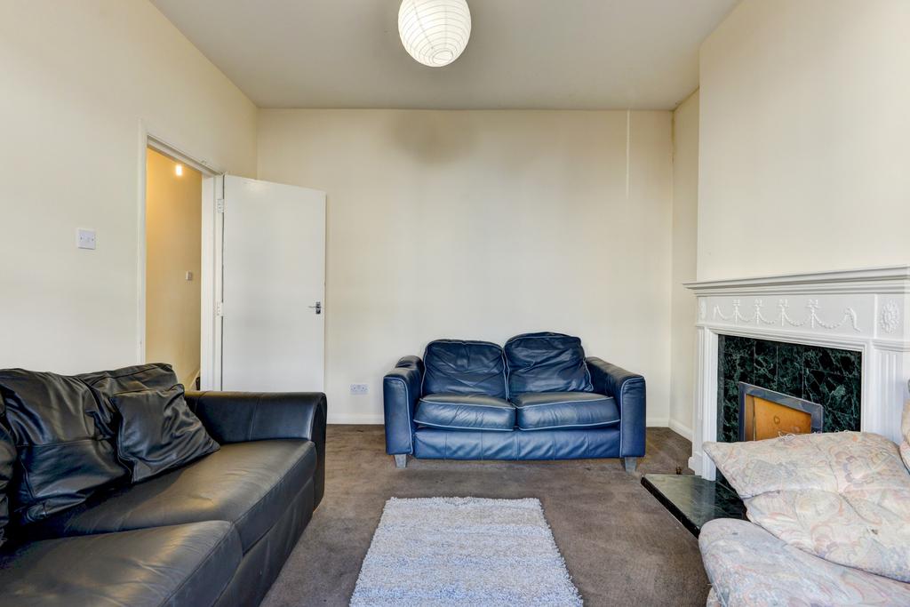 A spacious and well-maintained living room feat...
