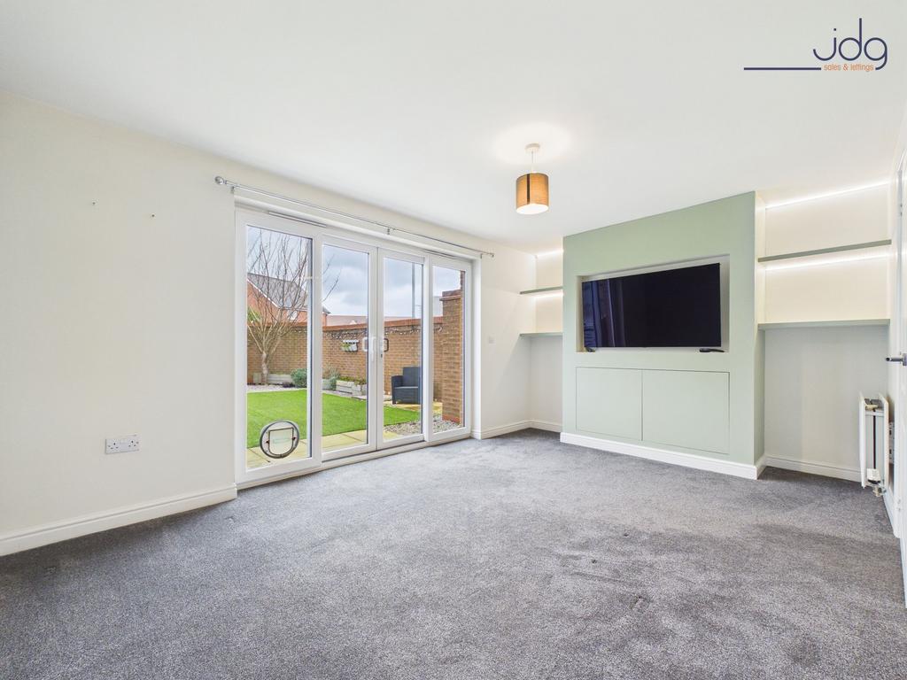 Living Room with sliding doors and media wall...