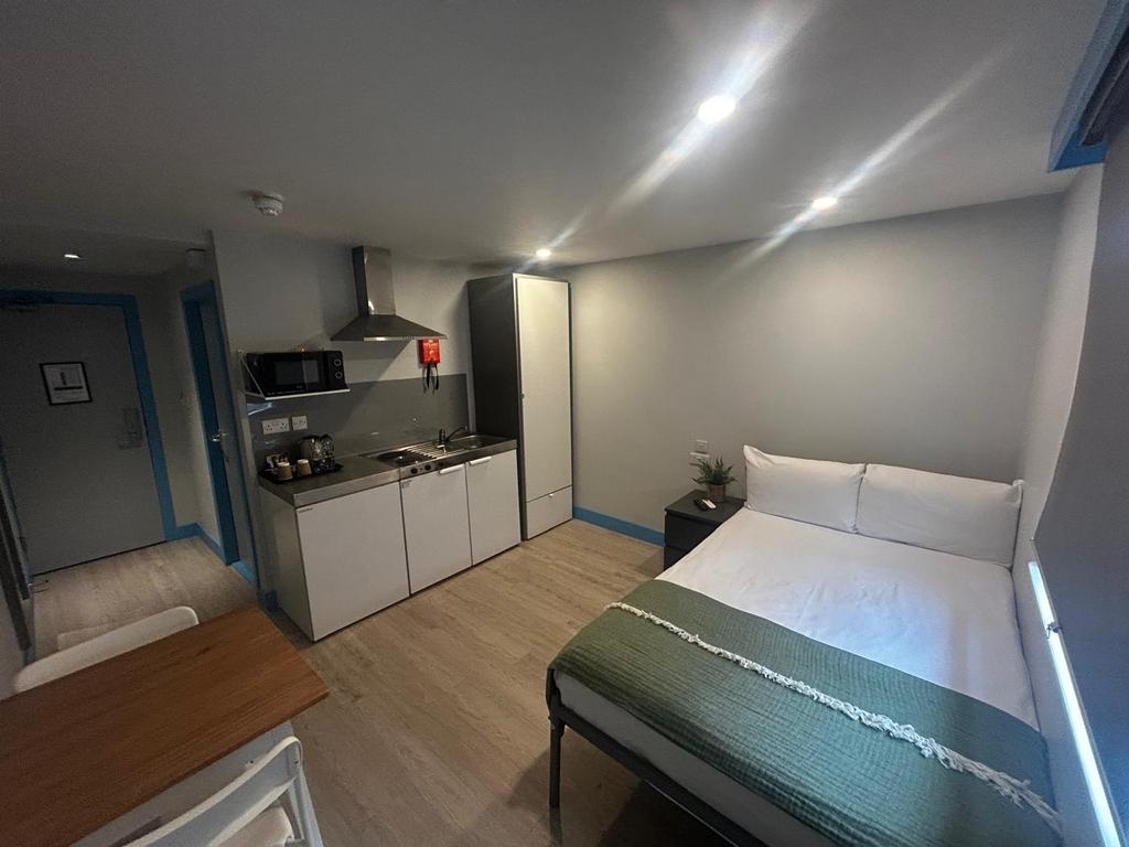 Bright, modern studio-style double bedroom with...