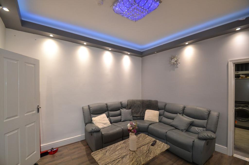 Modern living room with a comfortable grey corn...