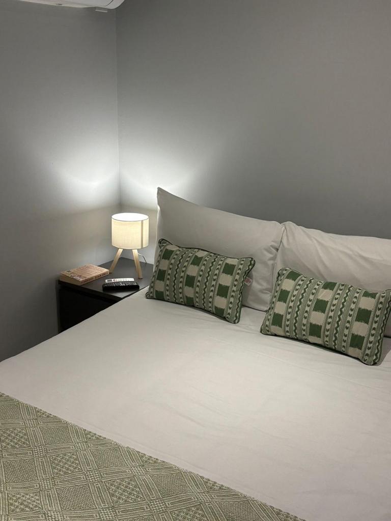 Bright, neatly presented bedroom with a comfort...