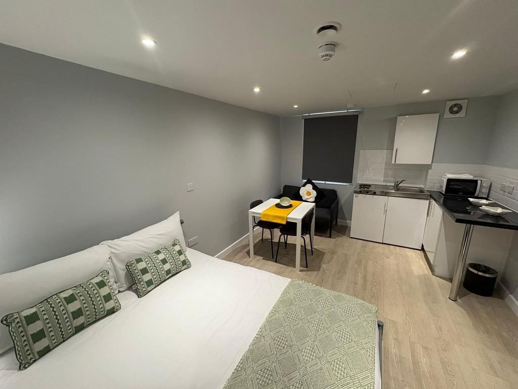 Bright, modern studio with a comfortable double...
