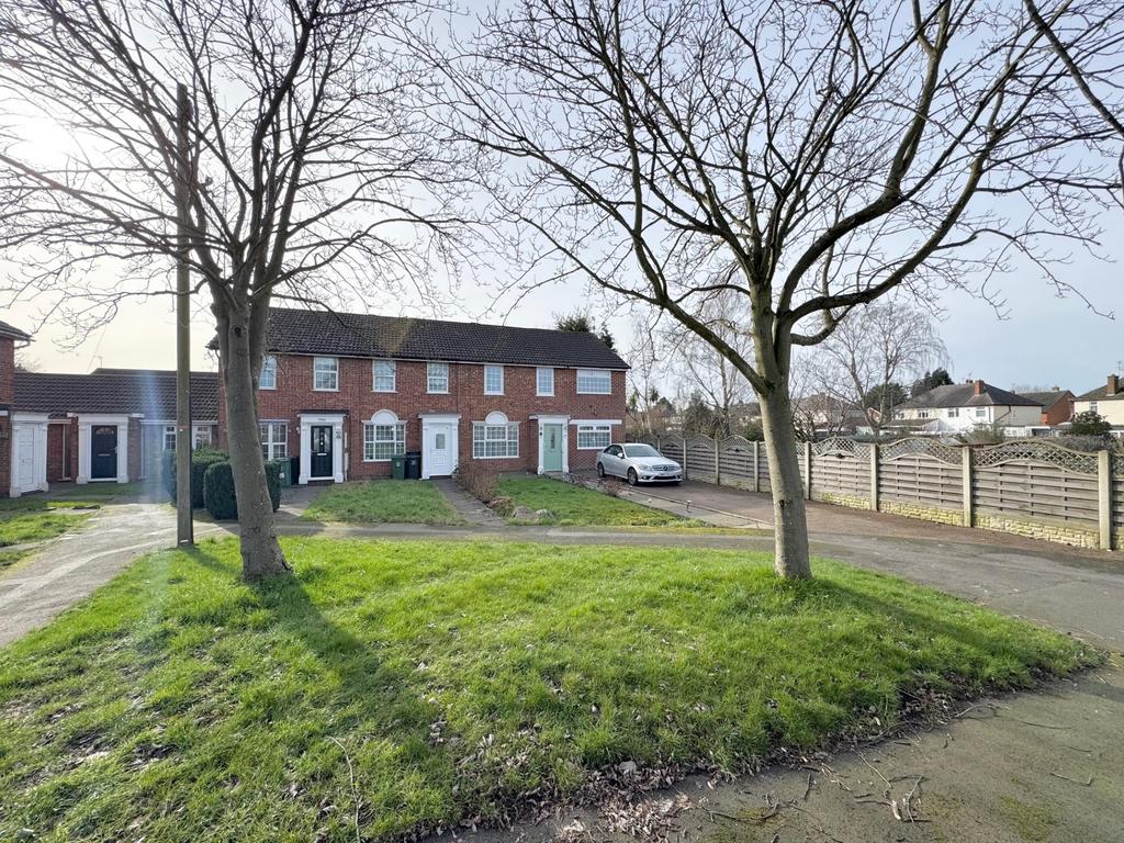 Front of property and green area